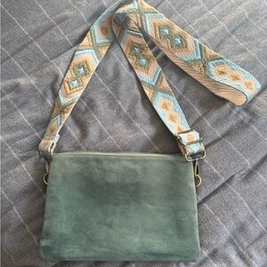 Jen & Co. Stylish Green Suede Bag with Patterned Guitar Strap.